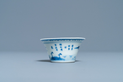 A Chinese blue and white inscribed wine cup, Kangxi
