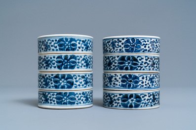 A pair of Chinese blue and white four-tier stacking boxes, a seal paste box and four saucers, 19th C.