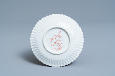 A Chinese famille rose teapot on stand with applied floral design, Yongzheng