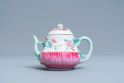 A Chinese famille rose teapot on stand with applied floral design, Yongzheng