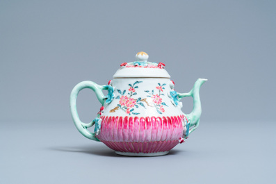 A Chinese famille rose teapot on stand with applied floral design, Yongzheng
