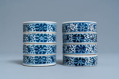 A pair of Chinese blue and white four-tier stacking boxes, a seal paste box and four saucers, 19th C.