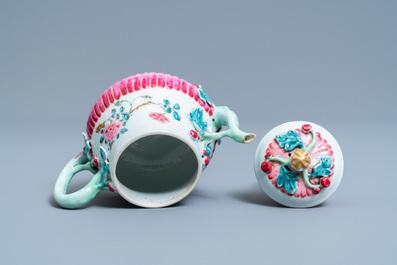 A Chinese famille rose teapot on stand with applied floral design, Yongzheng
