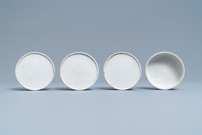 A pair of Chinese blue and white four-tier stacking boxes, a seal paste box and four saucers, 19th C.