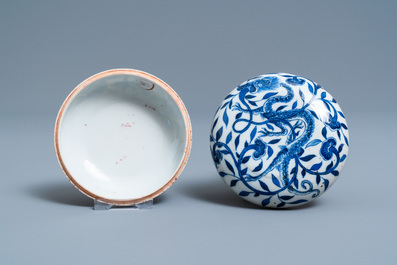 A pair of Chinese blue and white four-tier stacking boxes, a seal paste box and four saucers, 19th C.
