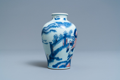 A Chinese blue, white and copper red 'qilin and phoenix' vase, Qing