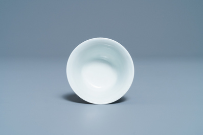 A Chinese blue and white inscribed wine cup, Kangxi