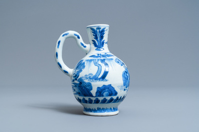 A Chinese blue and white ewer with figures in a landscape, Transitional period