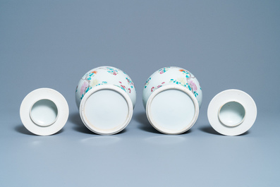 A pair of Chinese famille rose vases and covers, 19th C.