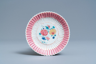 A Chinese famille rose teapot on stand with applied floral design, Yongzheng