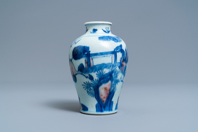 A Chinese blue, white and copper red 'qilin and phoenix' vase, Qing