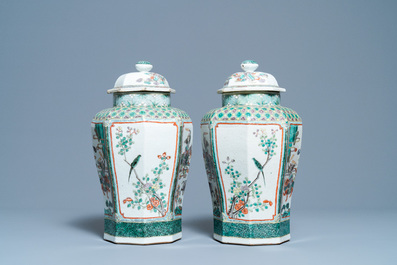 A pair of Chinese octagonal famille verte vases and covers, 19th C.