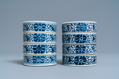 A pair of Chinese blue and white four-tier stacking boxes, a seal paste box and four saucers, 19th C.