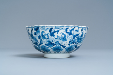 A Chinese blue and white lotus-molded 'playing boys' bowl, Chenghua mark, Kangxi