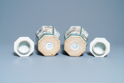 A pair of Chinese octagonal famille verte vases and covers, 19th C.