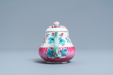 A Chinese famille rose teapot on stand with applied floral design, Yongzheng