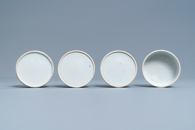 A pair of Chinese blue and white four-tier stacking boxes, a seal paste box and four saucers, 19th C.