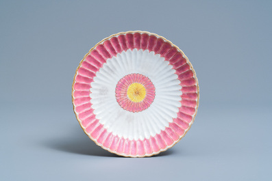 A Chinese famille rose teapot on stand with applied floral design, Yongzheng