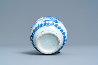 A Chinese blue and white ewer with figures in a landscape, Transitional period