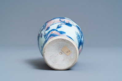 A Chinese blue, white and copper red 'qilin and phoenix' vase, Qing