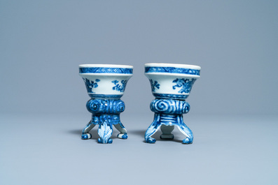 A pair of Chinese blue and white rococo-style tripod salts, Qianlong