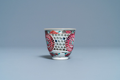 A Chinese reticulated double-walled famille rose cup and saucer, Yongzheng