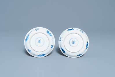 A pair of Chinese blue and white cups and saucers, Kangxi