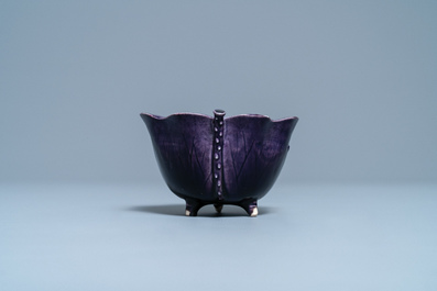 A Chinese aubergine- and turquoise-glazed 'lotus' trick cup, Kangxi