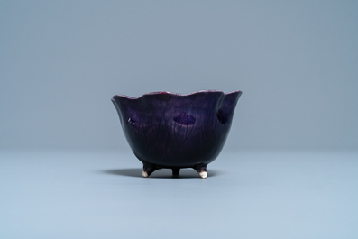 A Chinese aubergine- and turquoise-glazed 'lotus' trick cup, Kangxi