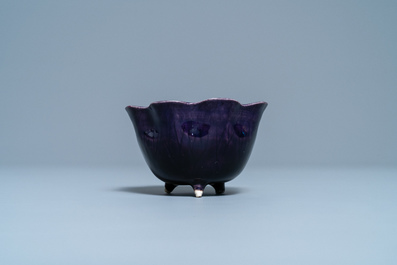 A Chinese aubergine- and turquoise-glazed 'lotus' trick cup, Kangxi