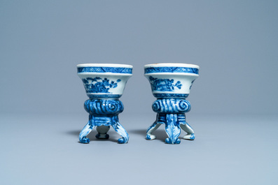 A pair of Chinese blue and white rococo-style tripod salts, Qianlong