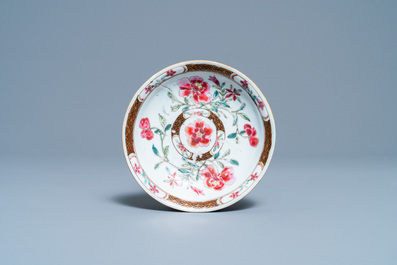 A Chinese reticulated double-walled famille rose cup and saucer, Yongzheng