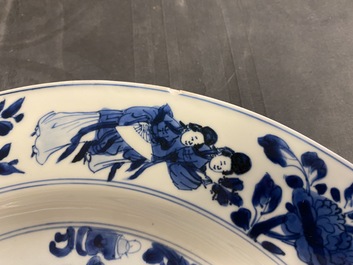A Chinese blue and white dish with ladies around a jardini&egrave;re, Kangxi