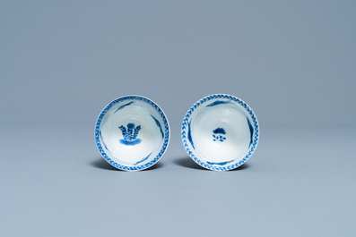 A pair of Chinese blue and white cups and saucers, Kangxi