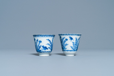A pair of Chinese blue and white cups and saucers, Kangxi