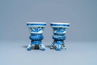 A pair of Chinese blue and white rococo-style tripod salts, Qianlong