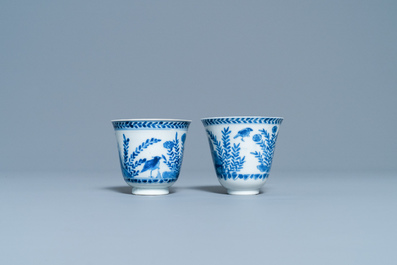 A pair of Chinese blue and white cups and saucers, Kangxi