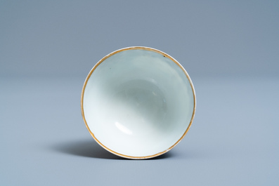 A Chinese export porcelain cup and saucer with a herring merchant, Qianlong