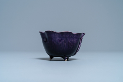 A Chinese aubergine- and turquoise-glazed 'lotus' trick cup, Kangxi
