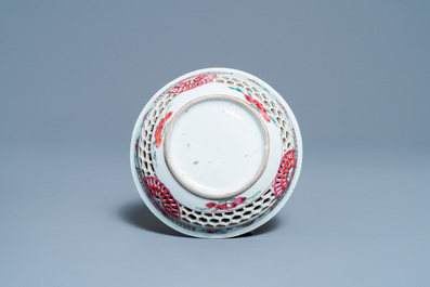 A Chinese reticulated double-walled famille rose cup and saucer, Yongzheng