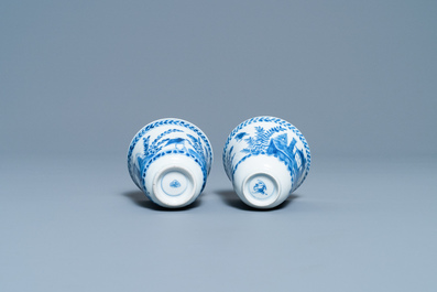 A pair of Chinese blue and white cups and saucers, Kangxi