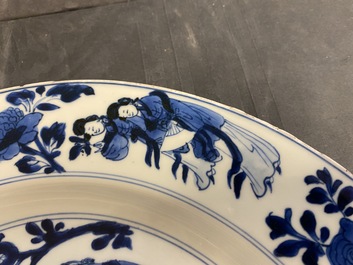 A Chinese blue and white dish with ladies around a jardini&egrave;re, Kangxi