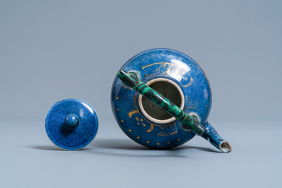 A Chinese powder blue and gilt teapot with verte biscuit handle, Kangxi