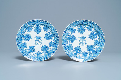 A pair of Dutch Delft blue and white plates with crowned monograms, 1st quarter 18th C.