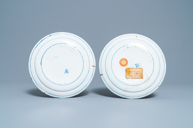 A pair of Dutch Delft blue and white plates with crowned monograms, 1st quarter 18th C.