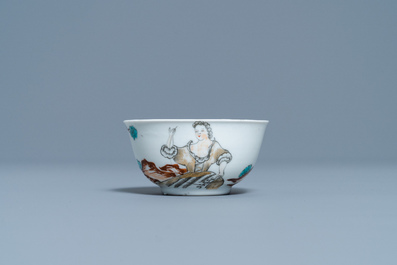 A Chinese export porcelain cup and saucer with a seamstress, Qianlong