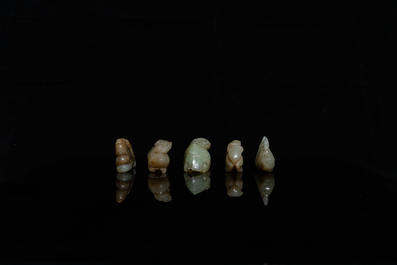 Five Chinese celadon and russet jade carvings, 19th C.