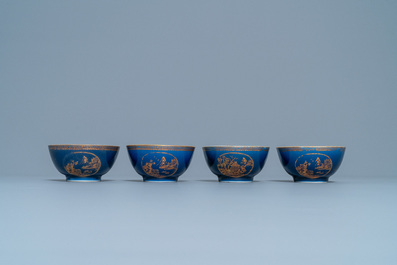 Four Chinese gilt-decorated blue-ground cups and saucers with fine landscapes, Qianlong
