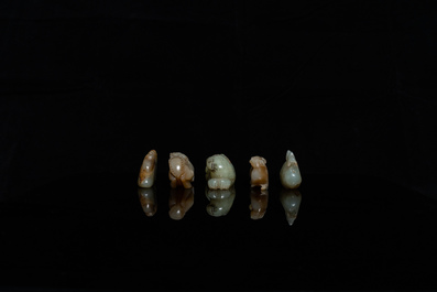 Five Chinese celadon and russet jade carvings, 19th C.