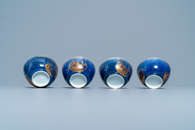 Four Chinese gilt-decorated blue-ground cups and saucers with fine landscapes, Qianlong
